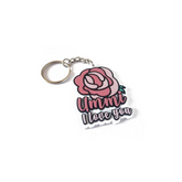 Roze sleutelhanger -ummi met liefde je tekst en bloemontwerp voor liefde u